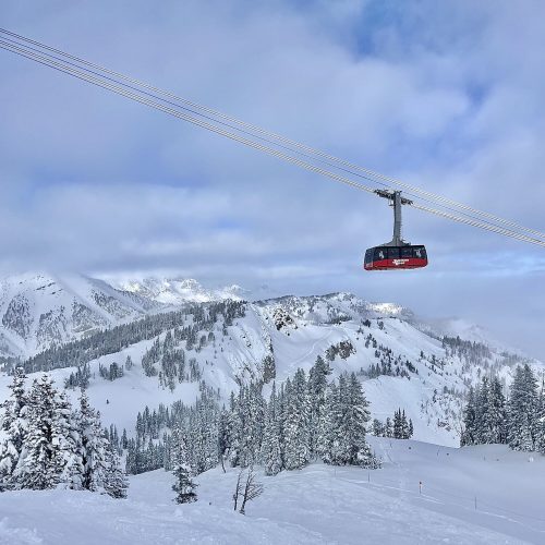 Downhill alpine skiing in Jackson Hole Mountain Resort in Wyoming, USA. Winter sports activities for the whole family in powder snow.